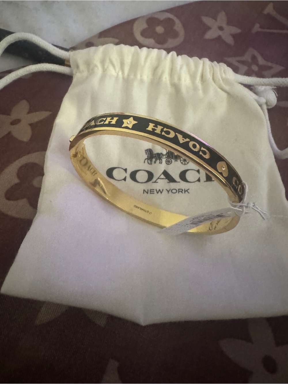Coach Gold-tone Bangle with Black Logo Inlay